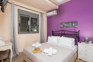 Postel nebo postele na pokoji v ubytování Villa Ammos + 26 fotografií