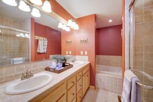 a bathroom with two sinks and a shower at Tahoe Donner Mountain Cabin Surrounded by Forest! in Truckee +24 photos