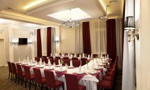 a conference room with a long table and chairs at Kiroff Hotel in Kharkiv