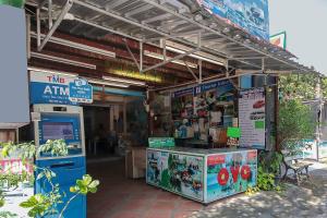a gas station with a pump and a machine at OYO 1148 Aonang Andaman Resort in Ao Nang Beach