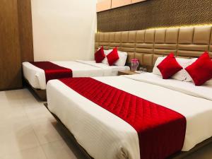 Postel nebo postele na pokoji v ubytování Hotel Guestinn Residency