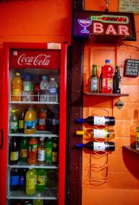 a coca cola refrigerator filled with lots of drinks at Waterloo Guest House in Black River