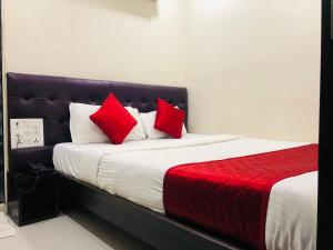 Postel nebo postele na pokoji v ubytování Hotel Guestinn Residency