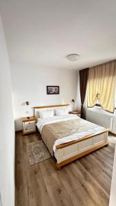 En eller flere senge i et værelse på Casa Ovidiu Rasnov