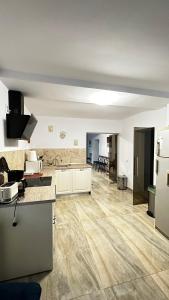 an empty kitchen and living room of an apartment at Casa Ovidiu Rasnov in Râşnov