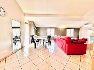 a living room with a red couch and a table at CC OT La Maison de Paule OLD TOWN PROMENADE DES A in Nice