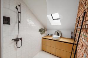 a bathroom with a sink and a shower at The barn - Waasmunster in Waasmunster +18 photos