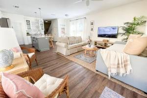 a living room with a couch and a table at The Floridian Newly Built Dreamhome Central in Gainesville