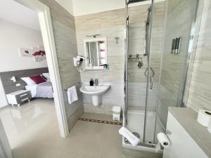 a bathroom with a shower and a sink at Bed & Breakfast CORSO ROMA in Apricena