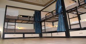 a room with three bunk beds in a room at CconfortHotels Host Bari Centrale SELF CHECK IN in Bari