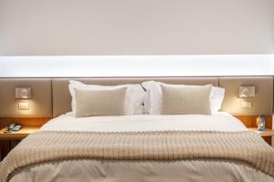 Cama ou camas em um quarto em Quality Hotel Pampulha & Convention Center