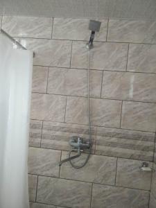 a shower with a hose in a bathroom at Khachik White Canyon in Khachʼik