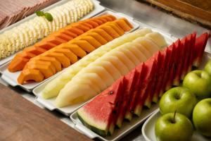 a tray filled with different types of fruits and vegetables at Quality Hotel Pampulha & Convention Center in Belo Horizonte