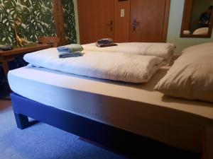 two beds sitting next to each other in a room at Haus Gertraud in Oetz