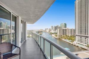 a balcony with a view of a river in a city at Spacious Luxury Ocean View 4 Bdrs 3Baths 17 FL in Hallandale Beach