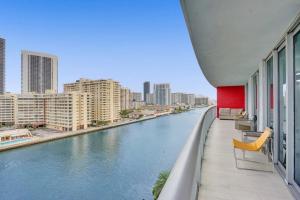 a view of a river from the balcony of a building at Awesome Ocean View Modern Condo Pool Shuttle in Hallandale Beach