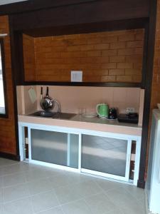 a miniature kitchen with a counter and a sink at Wilai Villa Lamai in Lamai