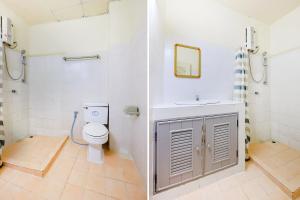 a bathroom with a toilet and a sink at OYO 629 Chaytalay Palace Hotel in Nathon