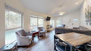 a living room with a couch and a table at Air Haus in Fourth Crossing