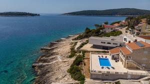 an aerial view of a house next to the water at Holiday House Nova in Blato