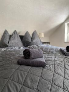 a stuffed animal sitting on top of a bed at Haus OS in Bischofshofen