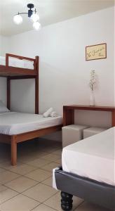 Кровать или кровати в номере Riveri Salinas host