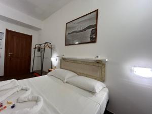 Voodi või voodid majutusasutuse Aigua toas