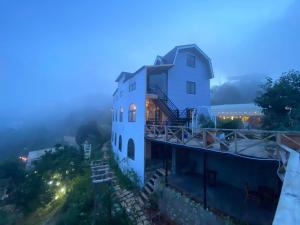 a house on top of a hill at night at Dream Garden Homestay Cầu Đất in Xuân Trường