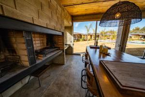 a dining room with a table and a fireplace at OMM Suites Resort, Villa General Belgrano in Villa General Belgrano