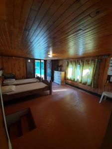 a large room with a bed in a cabin at Chalet - Chalets 494 in Lans-en-Vercors