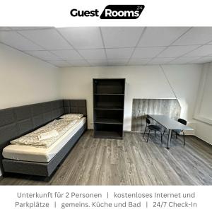 a room with a bed and a table and a desk at Unterkunft für 2 - GuestRooms24 - Marl in Marl