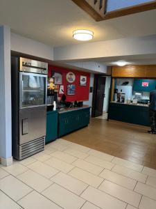 a large kitchen with a large appliance in a room at Super 8 by Wyndham Blytheville in Blytheville