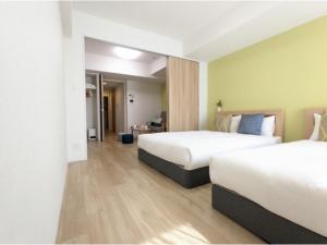 Giường trong phòng chung tại Eslead Hotel Namba South III - Vacation STAY 39771v