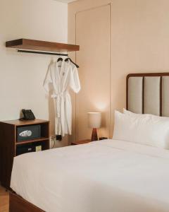 Postel nebo postele na pokoji v ubytování Kahal Hotel - Paseo Montejo