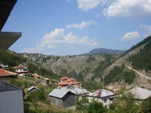 a view of a village with mountains in the background at Guest House Jani in Trigrad