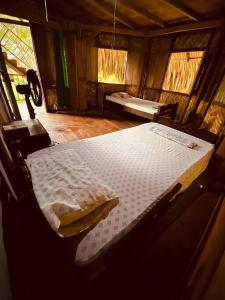 Ένα ή περισσότερα κρεβάτια σε δωμάτιο στο Casa Komerio