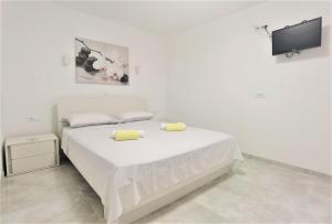 Кровать или кровати в номере Apartments Danijela