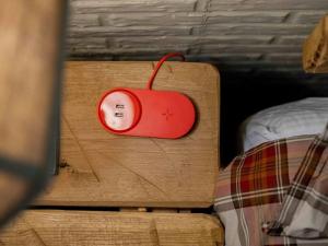 a red alarm clock sitting on a table next to a bed at Stonegate Lodge King Bed, WIFI, 50in Roku TV, Salt Water Pool Room #103 in Eureka Springs +20 photos