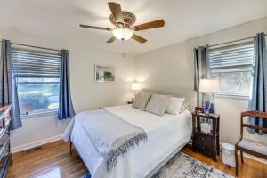 a bedroom with a bed and a ceiling fan at Lovely Lexington Home 4 Mi to Downtown! in Lexington