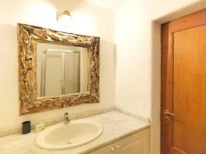 a bathroom with a sink and a mirror at Villa Hermes - Luxury Villa Paros in Kampos Paros