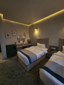 A bed or beds in a room at Eliana Hotel