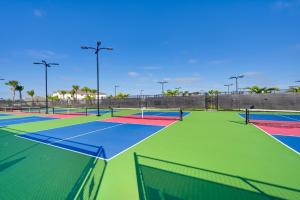 a group of tennis courts with at Breezy Ave Maria Condo with Golf Course On-Site! in Harker
