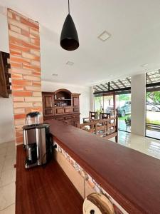 a kitchen with a counter with a coffee maker on it at Casa em Tucuns in Búzios
