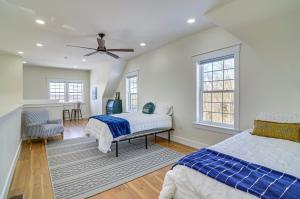 a bedroom with two beds and a ceiling fan at Dale Hollow Cottage with Covered Porch and Lake Views! in Frogue