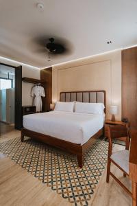 Postel nebo postele na pokoji v ubytování Kahal Hotel - Paseo Montejo