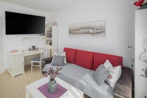Televízia a/alebo spoločenská miestnosť v ubytovaní 3 & 4 bedrooms apartment Simona