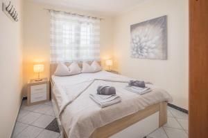 Posteľ alebo postele v izbe v ubytovaní 3 & 4 bedrooms apartment Simona