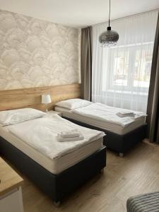 Posteľ alebo postele v izbe v ubytovaní Ubytování Cukrovar