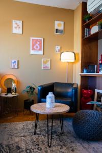 a living room with a couch and a table at WowAppartements vue sur le jet d'eau in Geneva