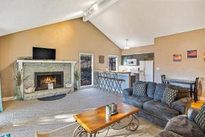 a living room with a couch and a fireplace at Ship Dock Lane A in Osage Beach